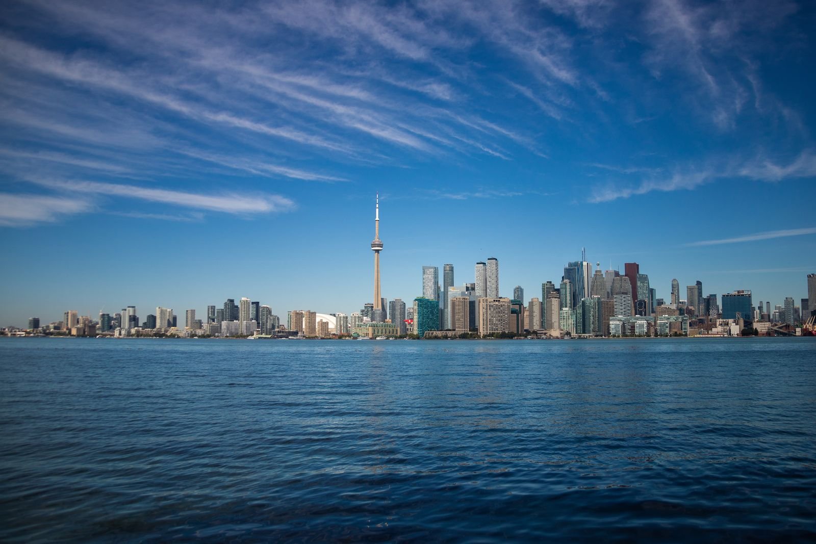 Toronto waterfront and city skyline seen across the lake