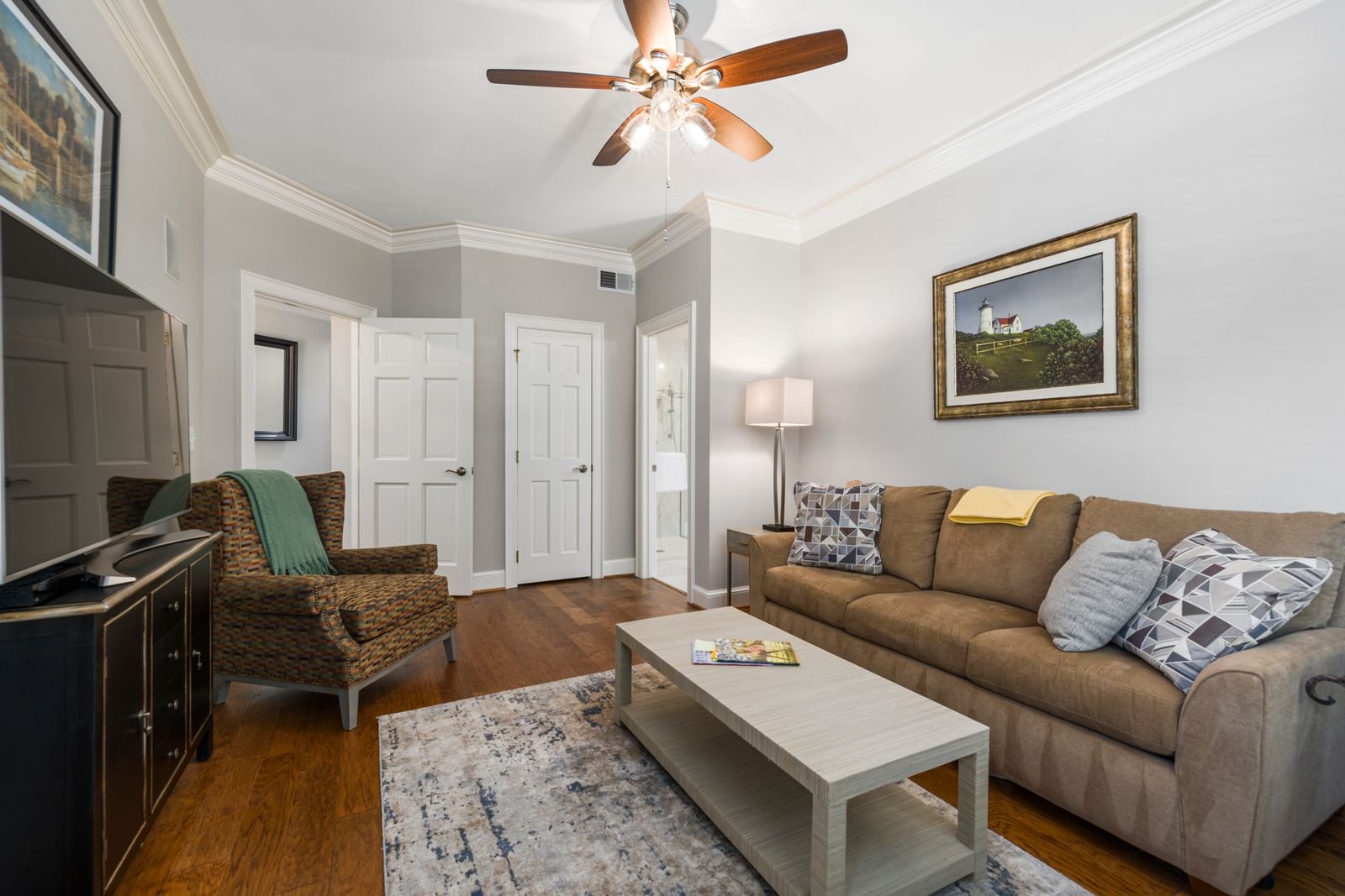 Cosy furnished living room with a couch, armchair and side table
