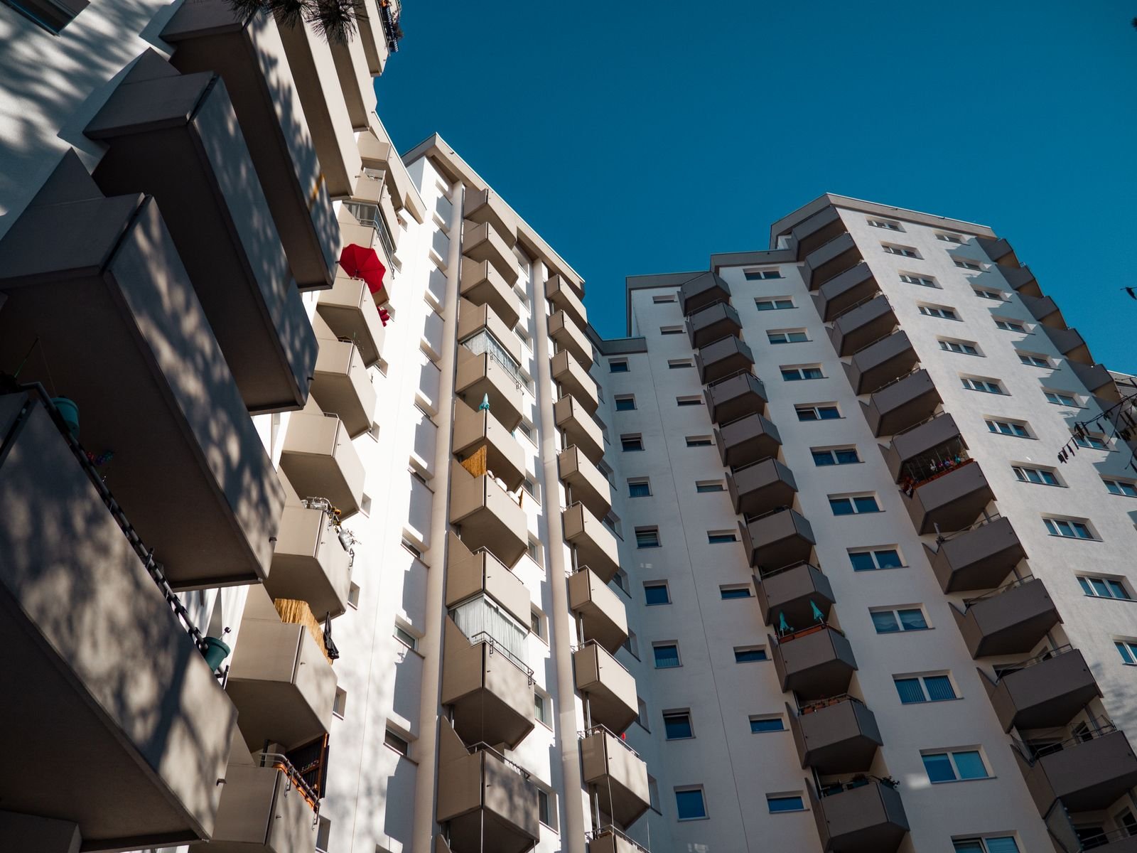 Low angle view of modern residential apartment buildings against the sky