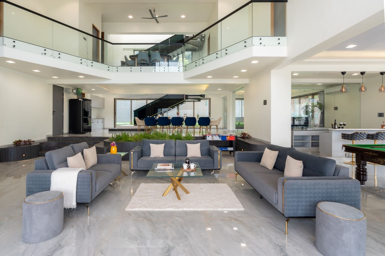 Living room of a furnished managed apartment with a sofa, armchair and floor lamp
