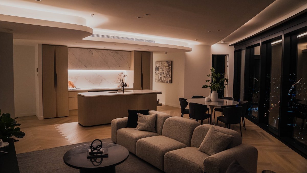 Evening interior of a two bedroom waterfront condominium in Toronto with city lights through the windows